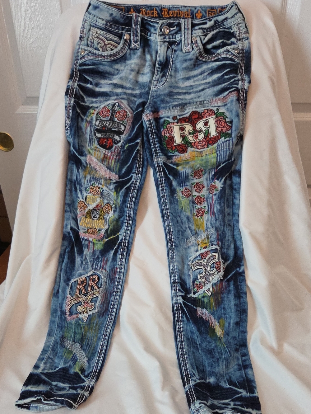 Rock Revival Women's Blue Denim Skinny Jeans with Multicolor Embroidered Patches